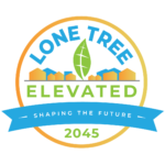 The logo for the Lone Tree Elevated Comprehensive Plan Update project. It is circular, with shapes of homes and buildings inside. A banner reads "Shaping the Future"
